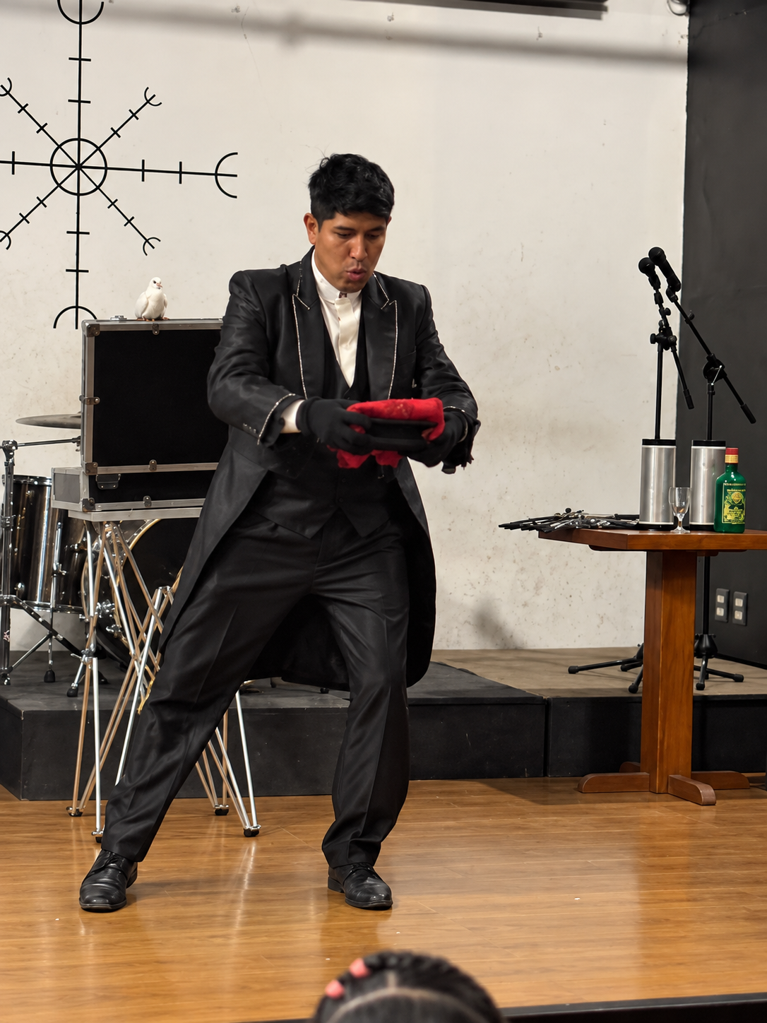 An illusionism demonstration with a hat during the gathering with the Academia Boliviana de Magia