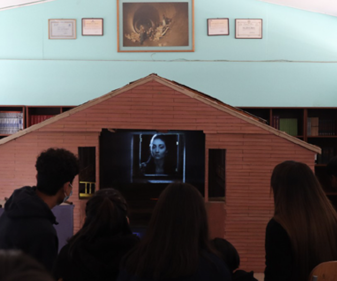 A stage with a wood and screen structure