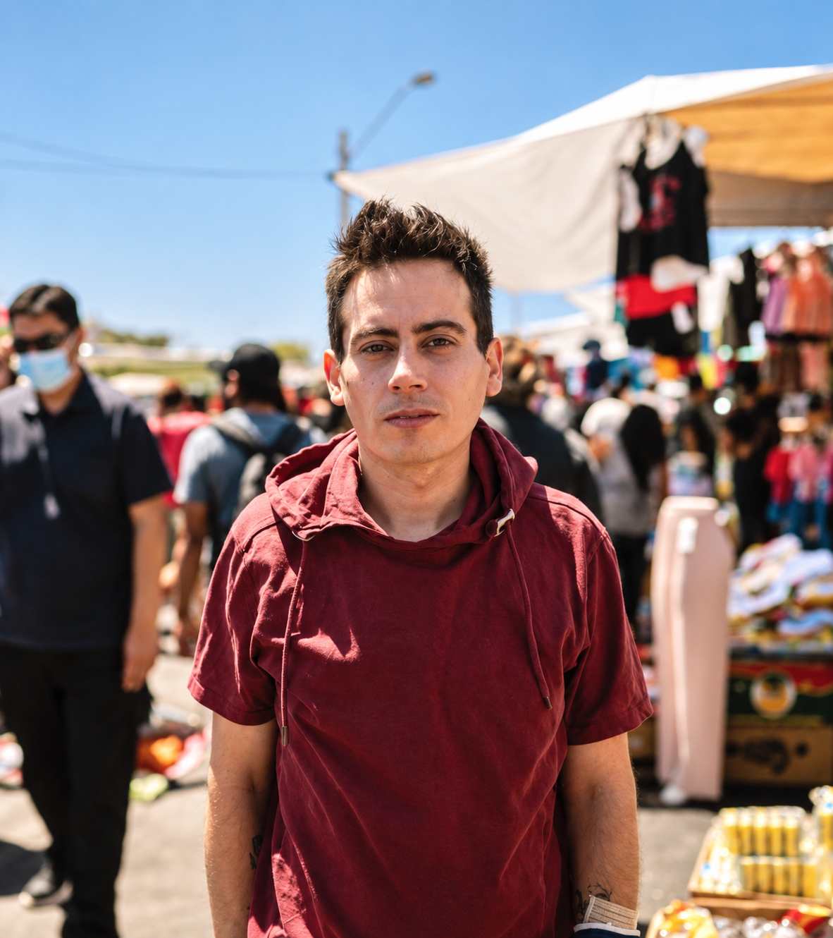 Young with Red Polymer in an Outdoor Market